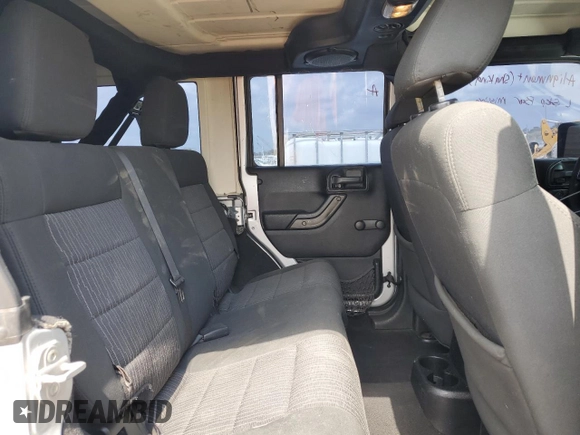 2012 Jeep Wrangler Unlimited Sport z VIN 1C4BJWDG8CL220960, wystawiony jako Copart lot #57823315 z przebiegiem 177 541 mil mil oraz Szkoda całkowita • Salvage title. Historia ofert i sprzedaży dostępna na DreamBid. Obrazek 11.