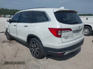 2022 Honda Pilot Touring 7-Passenger z VIN 5FNYF5H67NB027356, wystawiony jako IAAI lot #42080323 z przebiegiem 56 826 mil mil oraz . Historia ofert i sprzedaży dostępna na DreamBid. Obrazek 3.