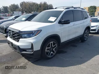 2023 Honda Passport Elite with VIN 5FNYF8H07PB010220, listed as a IAAI auction lot 41675730 with 25,128 mi miles and . Bid and sale history available at DreamBid. Image 2.