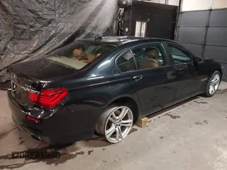 2014 BMW 7 Series ALPINA B7 xDrive with VIN WBAYF8C53ED141858, listed as a IAAI auction lot 40987098 with 128,404 mi miles and . Bid and sale history available at DreamBid. Image 4.