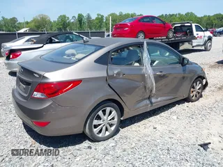 2014 Hyundai Accent GLS with VIN KMHCU4AE7EU736691, listed as a IAAI auction lot 42054514 with 80,715 mi miles and . Bid and sale history available at carsss.com. Image 4.