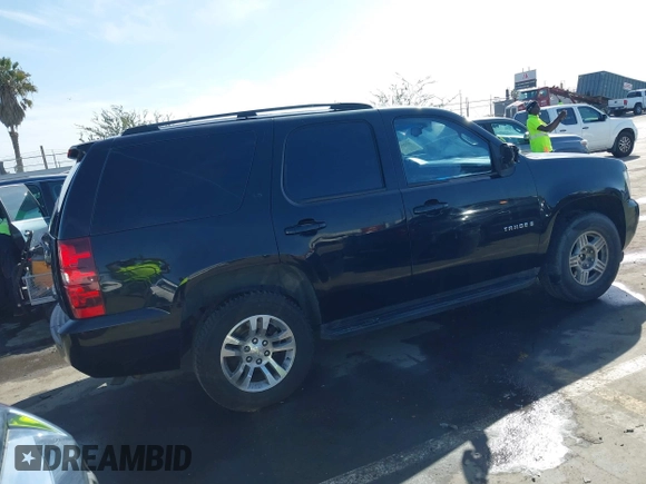 2007 Chevrolet Tahoe LTZ with VIN 1GNFC13J37R134588, listed as a IAAI auction lot 41725727 with 127,540 mi miles and . Bid and sale history available at DreamBid. Image 4.