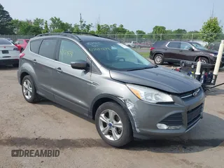 2014 Ford Escape SE with VIN 1FMCU9G92EUD90198, listed as a IAAI auction lot 42421878 with 88,616 mi miles and . Bid and sale history available at DreamBid. Image 1.