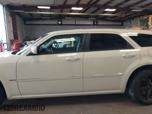 2006 Dodge Magnum z VIN 2D8GZ57286H100782, wystawiony jako IAAI lot #41816780 z przebiegiem 203 839 mil mil oraz . Historia ofert i sprzedaży dostępna na DreamBid. Obrazek 14.