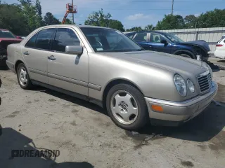 1997 Mercedes-Benz E 320 with VIN WDBJF72F0VA262484, listed as a Copart auction lot 54346945 with 145,352 mi miles and Salvage Title. Bid and sale history available at DreamBid. Image 4.