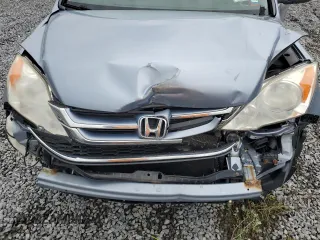 2011 Honda CR-V EX-L z VIN JHLRE4H7XBC031794, wystawiony jako Copart lot #58096785 z przebiegiem 164 794 mil mil oraz Szkoda całkowita • Salvage title. Historia ofert i sprzedaży dostępna na DreamBid. Obrazek 12.