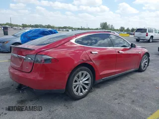 2016 Tesla Model S 70 with VIN 5YJSA1E16GF135833, listed as a IAAI auction lot 42084421 with 97,615 mi miles and . Bid and sale history available at DreamBid. Image 4.