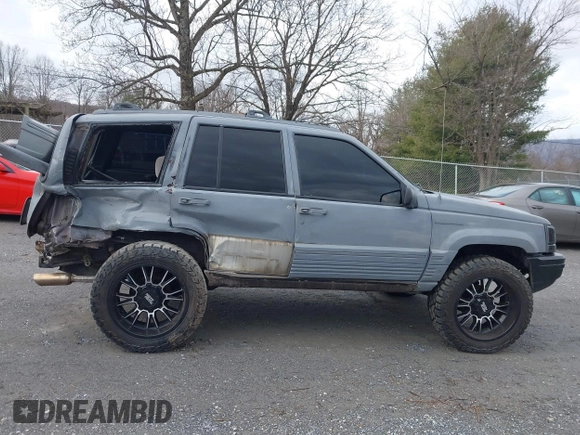 1995 Jeep Grand Cherokee Laredo with VIN 1J4GZ58S4SC778322, listed as a IAAI auction lot 41498800 with 255,058 mi miles. Bid and sale history available at carsss.com. Image 14.