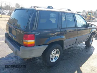 1996 Jeep Grand Cherokee Laredo with VIN 1J4GZ58S9TC268615, listed as a IAAI auction lot 41527984 with 248,443 mi miles. Bid and sale history available at carsss.com. Image 4.