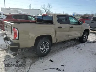 2021 GMC Canyon 4WD AT4 z VIN 1GTG6FEN8M1157828, wystawiony jako Copart lot #88392435 z przebiegiem 45 252 mil mil oraz Szkody całkowita. Historia ofert i sprzedaży dostępna na DreamBid. Obrazek 3.