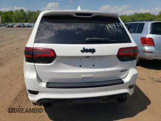 2018 Jeep Grand Cherokee with VIN NJ1449E, listed as a Copart auction lot 51357834 with 32,619 mi miles and Salvage title. Bid and sale history available at DreamBid. Image 6.