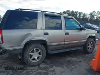 1999 GMC Yukon with VIN 1GKEK13R8XJ804104, listed as a IAAI auction lot 41359701 with 296,522 mi miles. Bid and sale history available at carsss.com. Image 13.