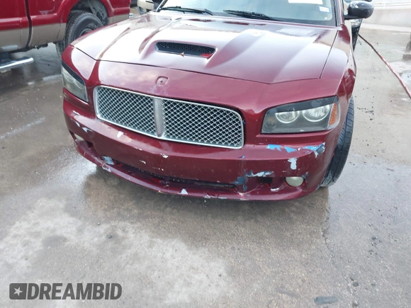 2006 Dodge Charger R/T with VIN 2B3KA53H36H260418, listed as a IAAI auction lot 42126007 with 242,331 mi miles and . Bid and sale history available at carsss.com. Image 6.