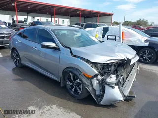 2017 Honda Civic Sedan Touring with VIN 19XFC1F90HE002301, listed as a IAAI auction lot 41815912 with 124,416 mi miles. Bid and sale history available at carsss.com. Image 1.