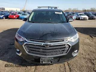 2018 Chevrolet Traverse Premier with VIN 1GNEVJKW5JJ152423, listed as a Copart auction lot 51202685 with 124,673 mi miles and Salvage Title. Bid and sale history available at DreamBid. Image 5.