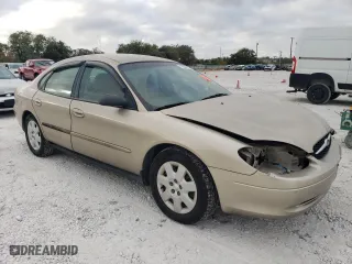 2001 Ford Taurus LX with VIN 1FAFP52U51A145880, listed as a Copart auction lot 77084934 with 54,143 mi miles and Salvage Title. Bid and sale history available at carsss.com. Image 4.