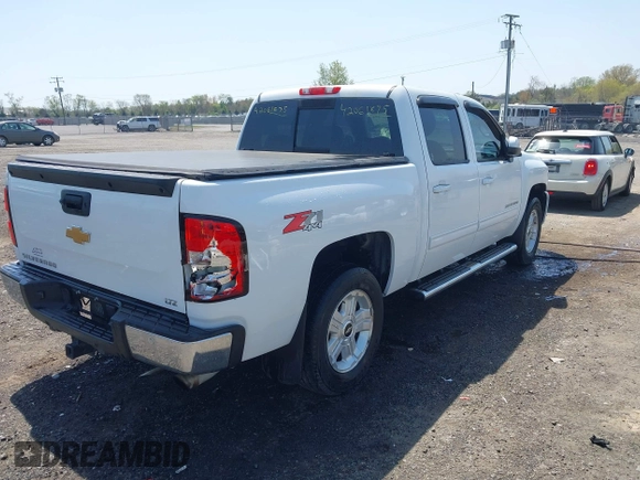 2013 Chevrolet Silverado 1500 LTZ with VIN 3GCPKTE24DG123063, listed as a IAAI auction lot 42061675 with 221,813 mi miles and . Bid and sale history available at DreamBid. Image 4.