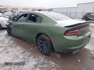 2021 Dodge Charger SXT with VIN 2C3CDXBG5MH570330, listed as a IAAI auction lot 41558328 with 119,828 mi miles. Bid and sale history available at carsss.com. Image 3.