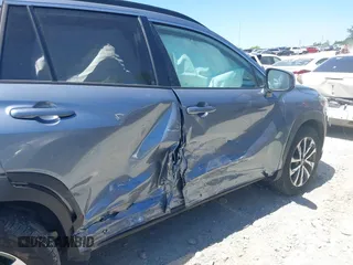 2023 Toyota Corolla Cross XLE z VIN 7MUDAABG7PV049417, wystawiony jako IAAI lot #42037055 z przebiegiem 28 325 mil mil oraz . Historia ofert i sprzedaży dostępna na DreamBid. Obrazek 6.