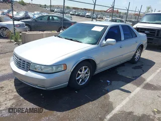 2003 Cadillac Seville Luxury SLS z VIN 1G6KS54Y43U214795, wystawiony jako IAAI lot #42348542 z przebiegiem 144 438 mil mil oraz . Historia ofert i sprzedaży dostępna na DreamBid. Obrazek 2.