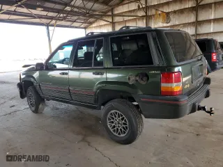 1995 Jeep Grand Cherokee Limited with VIN 1J4GZ78Y2SC723898, listed as a Copart auction lot 54142035 with 173,454 mi miles and Salvage Title. Bid and sale history available at carsss.com. Image 2.