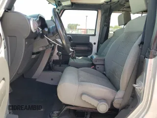 2009 Jeep Wrangler Sahara with VIN 1J4FA54149L708183, listed as a Copart auction lot 65989125 with 133,436 mi miles and Salvage title. Bid and sale history available at DreamBid. Image 7.