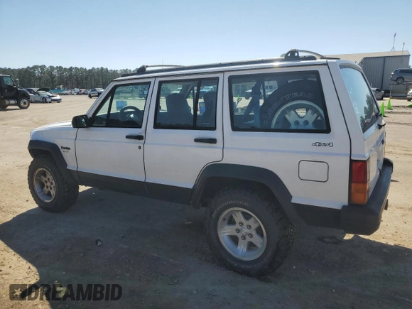 1995 Jeep Cherokee Sport with VIN 1J4FJ68S0SL646747, listed as a Copart auction lot 48772675 with 239,834 mi miles and Salvage title. Bid and sale history available at DreamBid. Image 2.
