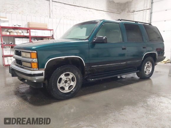 1996 Chevrolet Tahoe z VIN 1GNEK13R4TJ417000, wystawiony jako IAAI lot #41992121 z przebiegiem 166 215 mil mil oraz . Historia ofert i sprzedaży dostępna na DreamBid. Obrazek 2.