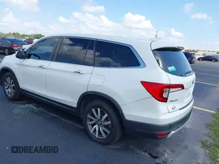 2020 Honda Pilot EX-L with VIN 5FNYF5H59LB028268, listed as a IAAI auction lot 42355620 with 107,033 mi miles and . Bid and sale history available at DreamBid. Image 3.