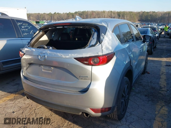 2018 Mazda CX-5 Touring with VIN JM3KFBCM6J0363767, listed as a IAAI auction lot 41776614 with 139,507 mi miles. Bid and sale history available at carsss.com. Image 4.