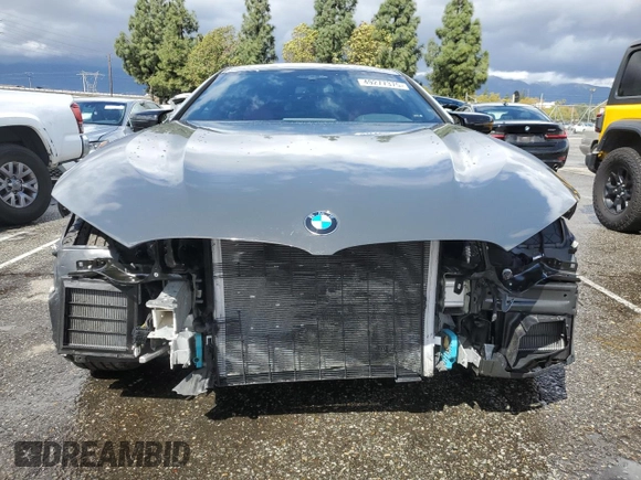 2025 BMW 8 Series M850i with VIN WBAGV8C07SCT18237, listed as a Copart auction lot 49277375 with 750 mi miles and Salvage title. Bid and sale history available at DreamBid. Image 5.