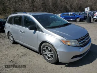 2011 Honda Odyssey EX-L with VIN 5FNRL5H69BB104978, listed as a Copart auction lot 52332375 with 221,526 mi miles and Non Repairable. Bid and sale history available at DreamBid. Image 4.