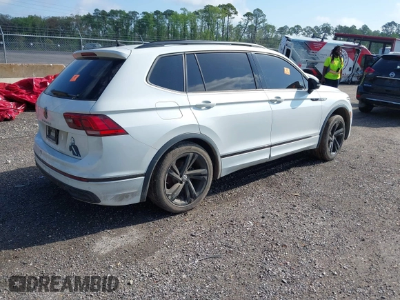 2023 Volkswagen Tiguan SE R-Line Black with VIN 3VVCB7AX9PM042025, listed as a IAAI auction lot 41913943 with 114,097 mi miles and . Bid and sale history available at DreamBid. Image 4.