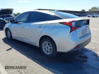 2021 Toyota Prius L Eco with VIN JTDKAMFUXM3144991, listed as a IAAI auction lot 42147025 with 106,466 mi miles and . Bid and sale history available at DreamBid. Image 3.
