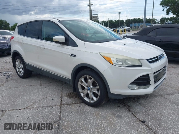 2013 Ford Escape SEL z VIN 1FMCU9HX5DUC33079, wystawiony jako IAAI lot #42521744 z przebiegiem 133 864 mil mil oraz . Historia ofert i sprzedaży dostępna na DreamBid. Obrazek 1.