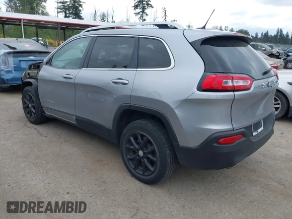 2014 Jeep Cherokee Latitude with VIN 1C4PJLCS1EW105984, listed as a IAAI auction lot 42242732 with 89,325 mi miles and . Bid and sale history available at DreamBid. Image 3.