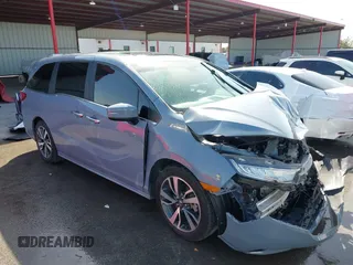2024 Honda Odyssey Touring z VIN 5FNRL6H82RB027601, wystawiony jako IAAI lot #41808680 z przebiegiem 25 911 mil mil oraz . Historia ofert i sprzedaży dostępna na DreamBid. Obrazek 1.