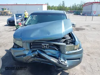 2006 Honda Ridgeline RTS z VIN 2HJYK16416H555455, wystawiony jako IAAI lot #42230715 z przebiegiem 315 387 mil mil oraz . Historia ofert i sprzedaży dostępna na DreamBid. Obrazek 13.