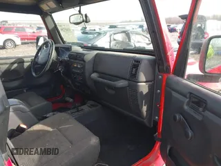 2003 Jeep Wrangler Sport with VIN 1J4FA49S53P305096, listed as a IAAI auction lot 41685209 with 165,247 mi miles. Bid and sale history available at carsss.com. Image 5.