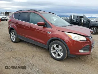 2015 Ford Escape SE with VIN 1FMCU9GX6FUC67715, listed as a Copart auction lot 73495244 with 184,183 mi miles and Salvage Title. Bid and sale history available at DreamBid. Image 4.