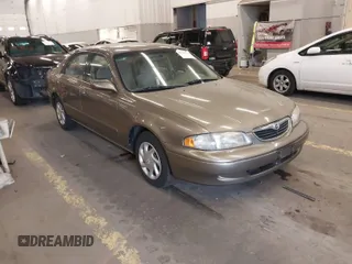 1999 Mazda 626 ES with VIN 1YVGF22C1X5852798, listed as a IAAI auction lot 41736489 with 136,536 mi miles. Bid and sale history available at carsss.com. Image 1.