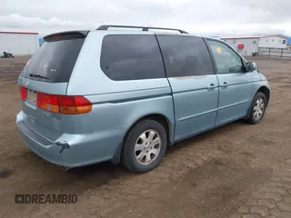 2003 Honda Odyssey EX z VIN 5FNRL186X3B136915, wystawiony jako IAAI lot #42231736 z przebiegiem 129 057 mil mil oraz . Historia ofert i sprzedaży dostępna na DreamBid. Obrazek 4.