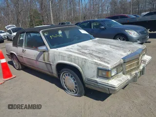 1986 Cadillac DeVille z VIN 1G6CD4782G4279123, wystawiony jako IAAI lot #41791973 z przebiegiem Nie podano mil oraz . Historia ofert i sprzedaży dostępna na DreamBid. Obrazek 1.