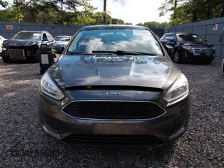 2018 Ford Focus SE z VIN 1FADP3FE0JL284107, wystawiony jako IAAI lot #42815845 z przebiegiem 110 155 mil mil oraz . Historia ofert i sprzedaży dostępna na DreamBid. Obrazek 12.