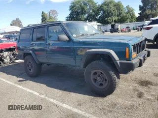 1997 Jeep Cherokee Sport with VIN 1J4FT68S4VL545385, listed as a Copart auction lot 49616325 with 239,798 mi miles and Salvage Title. Bid and sale history available at carsss.com. Image 4.