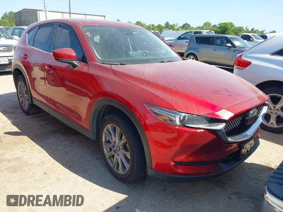 2021 Mazda CX-5 Grand Touring with VIN JM3KFADM4M0476615, listed as a IAAI auction lot 42004814 with 42,483 mi miles. Bid and sale history available at carsss.com. Image 1.