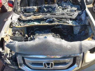 2009 Honda Pilot EX-L with VIN 5FNYF48699B023311, listed as a IAAI auction lot 41981928 with Not Provided miles and . Bid and sale history available at carsss.com. Image 10.