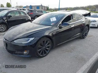 2017 Tesla Model S 100D with VIN 5YJSA1E28HF188981, listed as a IAAI auction lot 42010115 with 76,327 mi miles and . Bid and sale history available at DreamBid. Image 2.