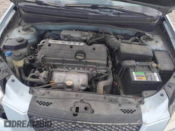 2009 Kia Rio LX with VIN KNADE223496469797, listed as a Copart auction lot 71005774 with 130,675 mi miles and Salvage Title. Bid and sale history available at DreamBid. Image 12.