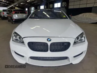 2014 BMW M6 z VIN WBSLX9C58ED160480, wystawiony jako Copart lot #64464985 z przebiegiem 58 514 mil mil oraz Czysty tytuł • Clean title. Historia ofert i sprzedaży dostępna na DreamBid. Obrazek 5.